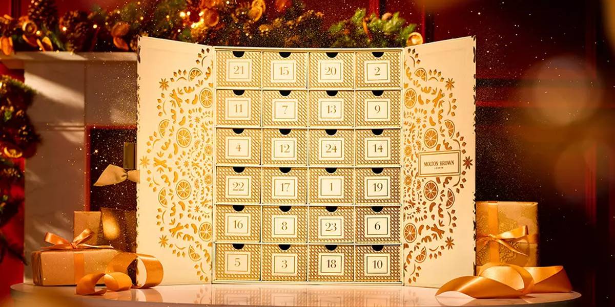 A Molton Brown Advent Calendar sitting atop a decorated table