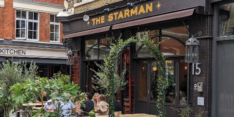 View of the Starman pub entrance and outdoor seating